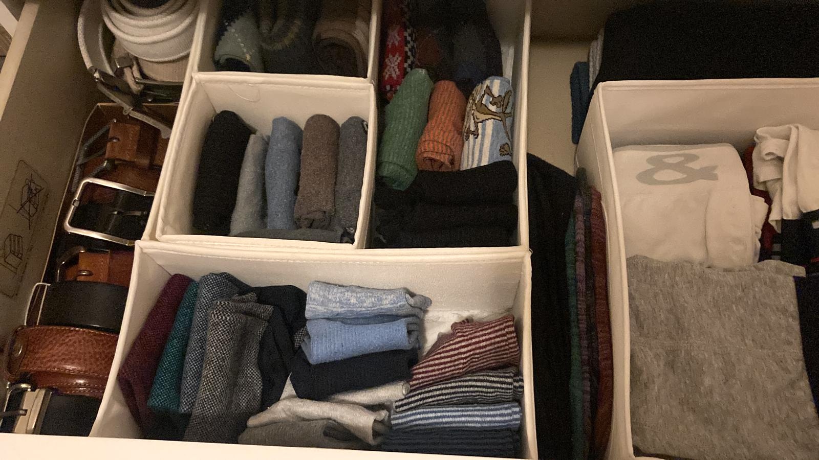 Drawer organised with fabric dividers for socks, belts and accessories